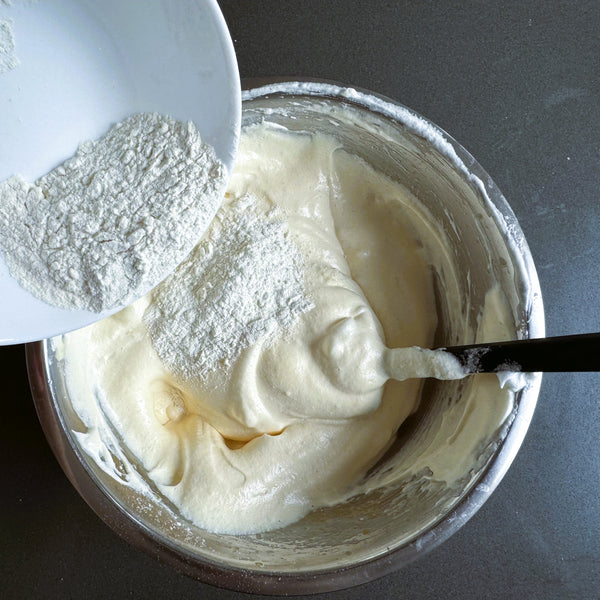 adding the flour to the egg mixture