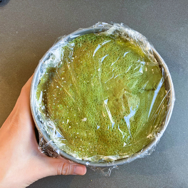 letting the matcha crepe cake chill in the refrigerator