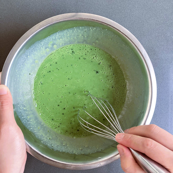 mixing matcha powder and sugar into the wet ingredients