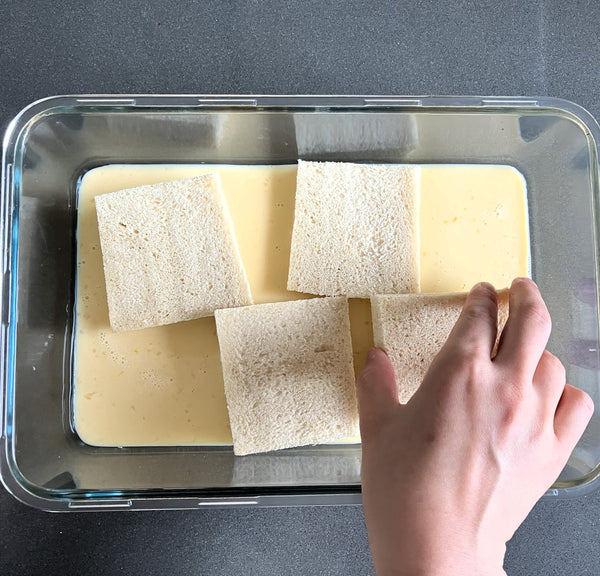 laying the shokupan into the custard