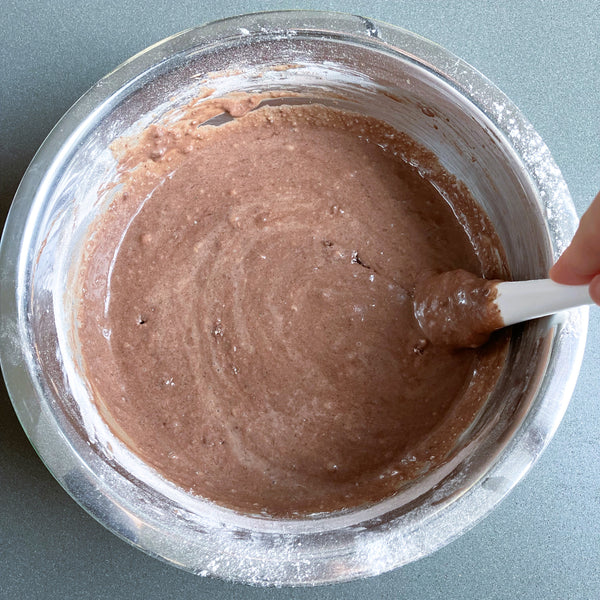 mixing the brownie batter together