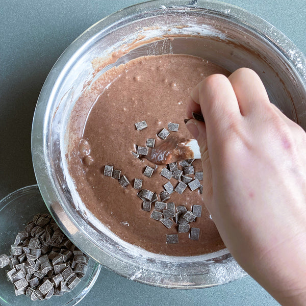 adding chocolate chunks into the mochi brownie batter