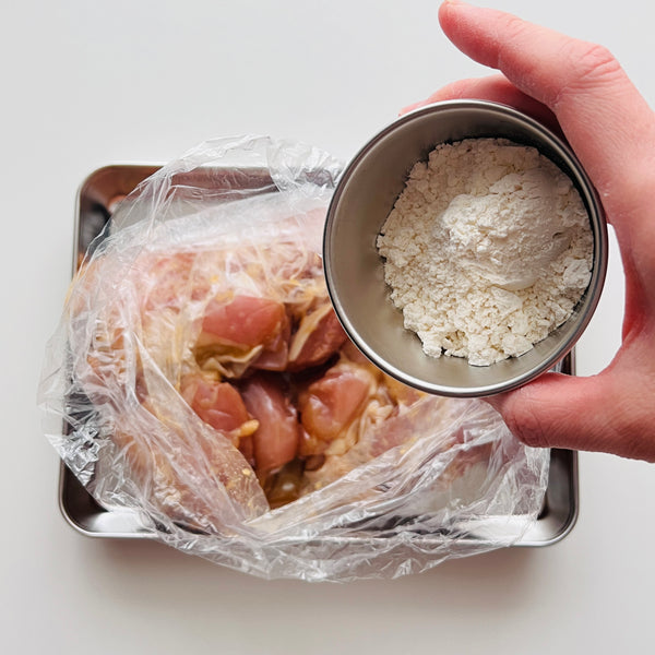 coating the chicken in flour