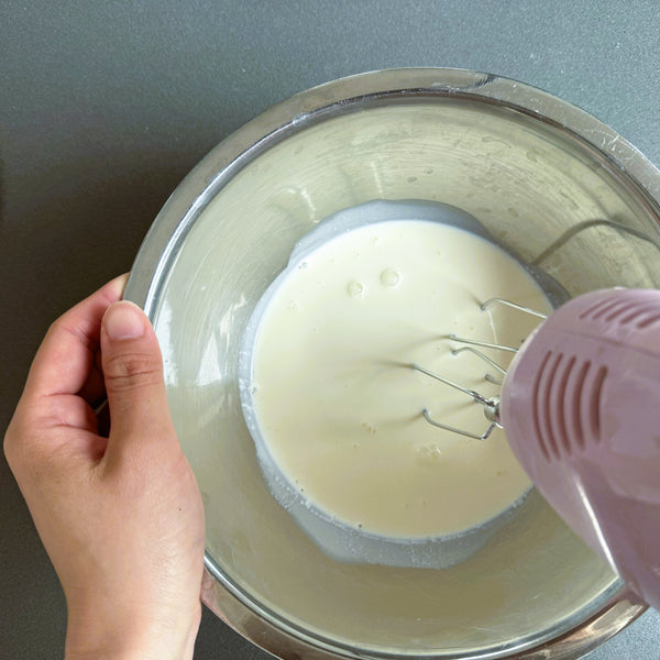 whipping the cream with an electric mixer