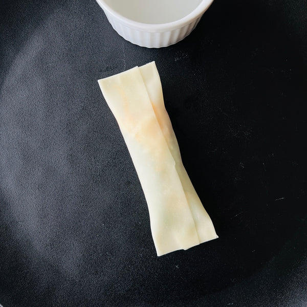 wrapping the gyoza into a stick shape