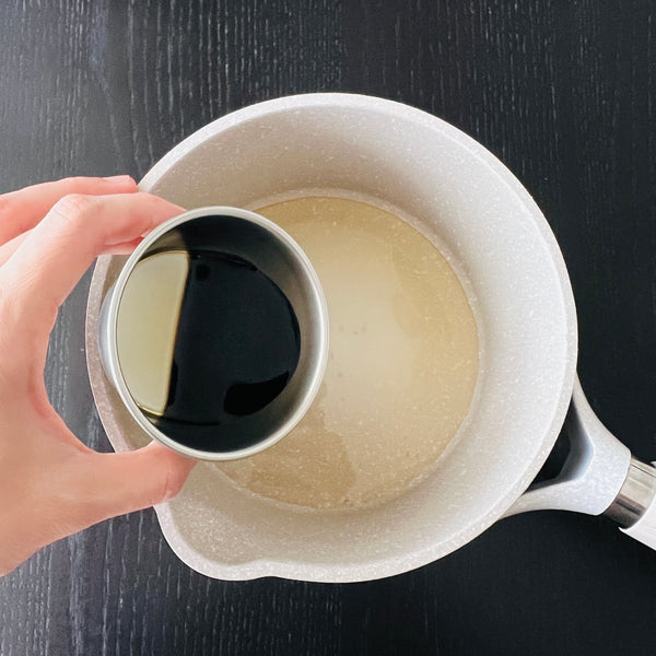 adding nanban sauce ingredients into a saucepan