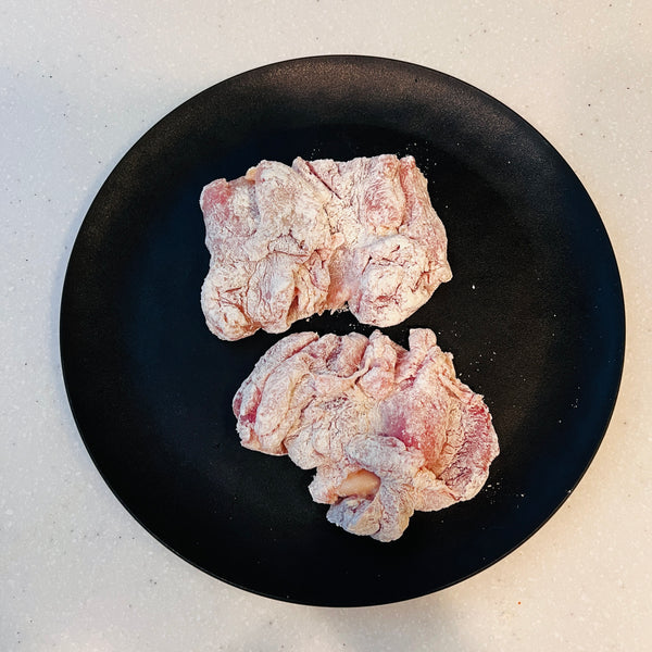 dredging the chicken in flour