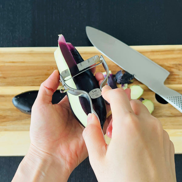 peeling the eggplants