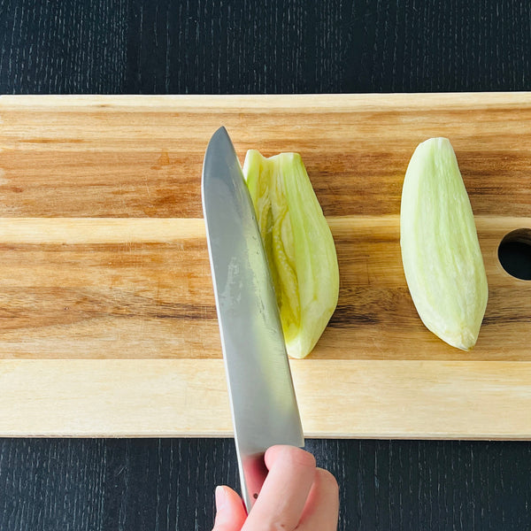 cutting the eggplant in half