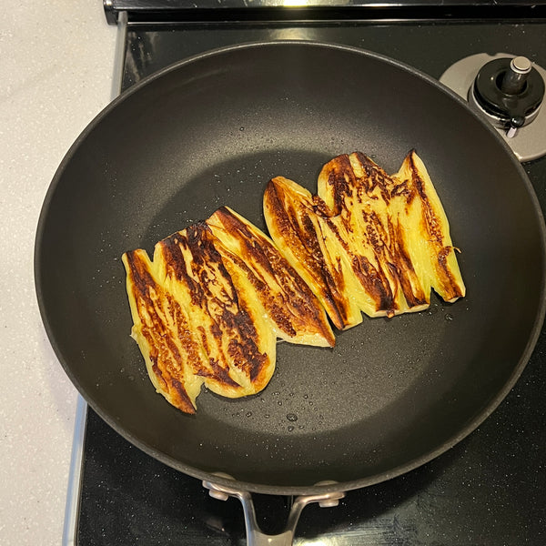 flipping the eggplants and letting them cook on the other side