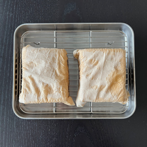 wrapping the tofu in paper towels