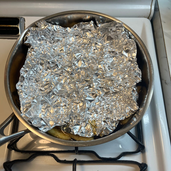 placing a piece of foil over the tofu pouches