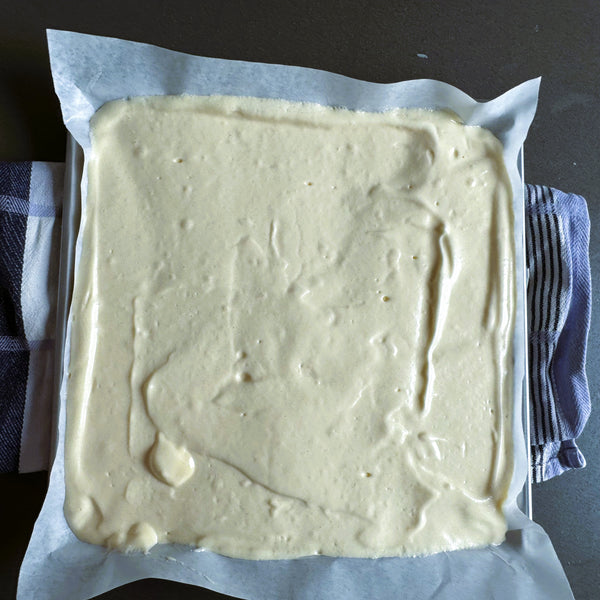 removing air bubbles from the cake batter before placing it into the oven