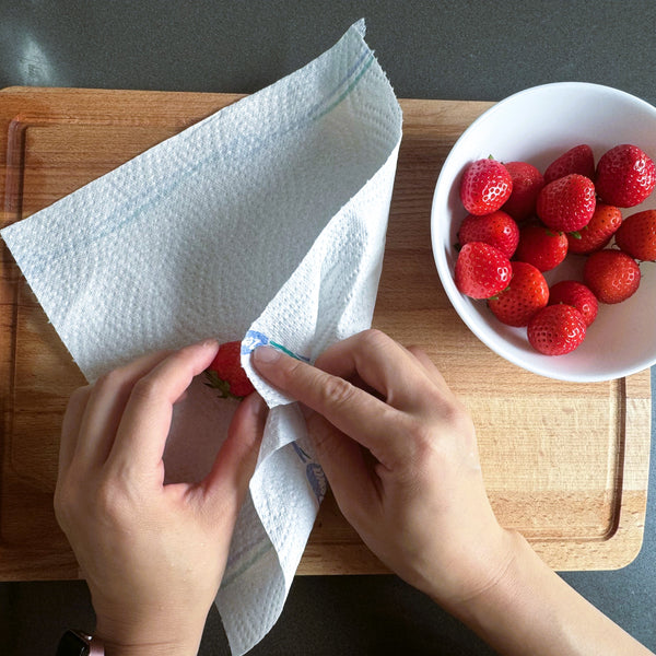 washing the strawberries and wiping them clean