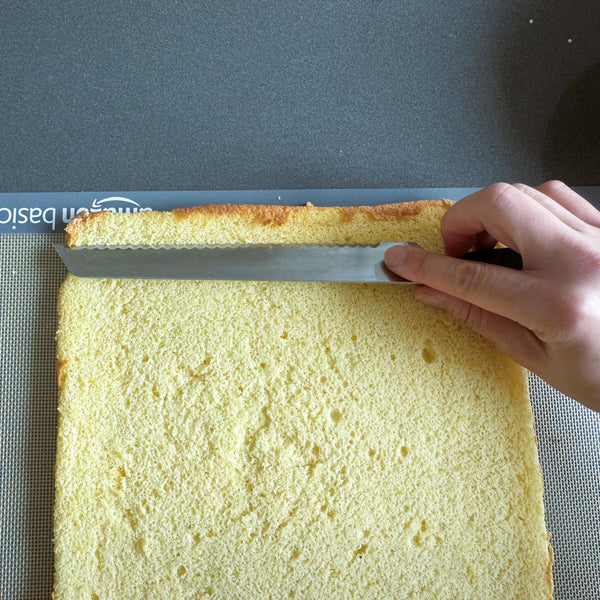 cutting the edges of the cake off