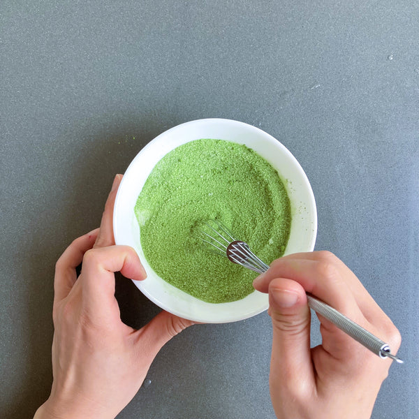 mixing matcha powder and sugar together