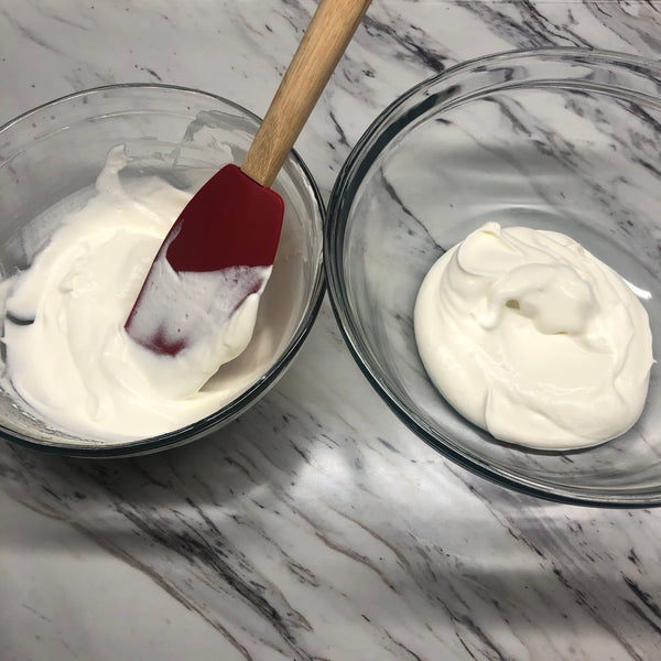 diving the cream into two bowls