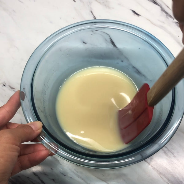 mixing the white chocolate mixture until the gelatin has completely dissolved