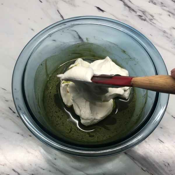 adding the whipped cream to the matcha mousse mixture