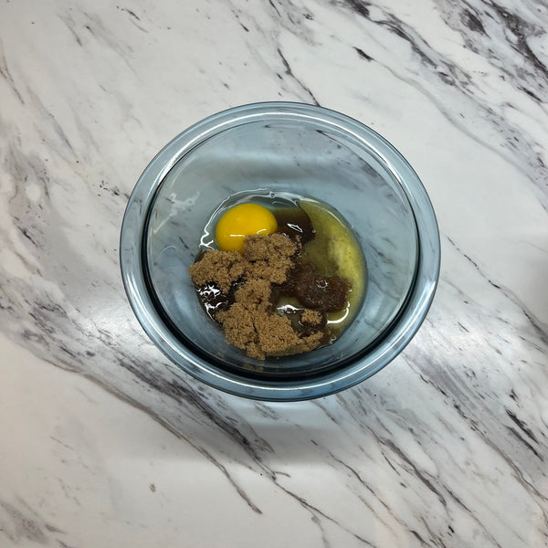 adding the wet ingredients into a bowl