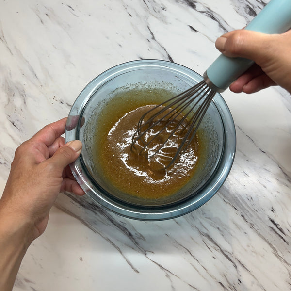 mixing the wet ingredients together with a whisk