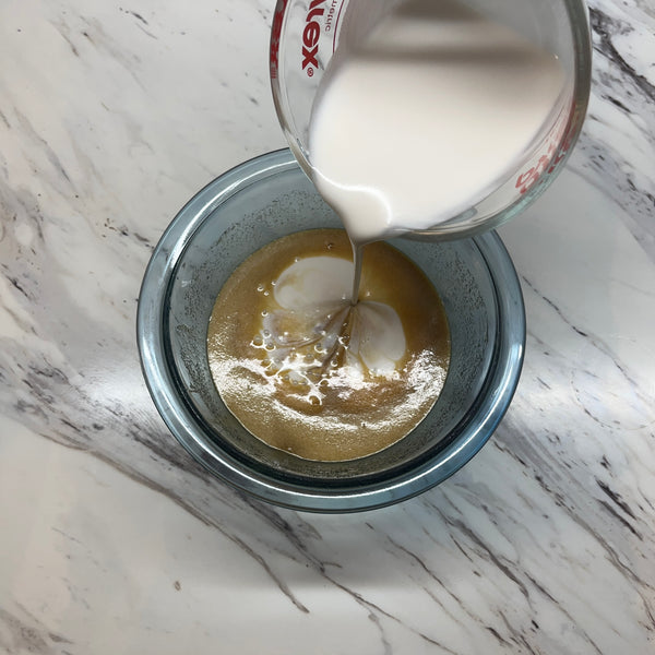 adding the coconut milk to the wet ingredients