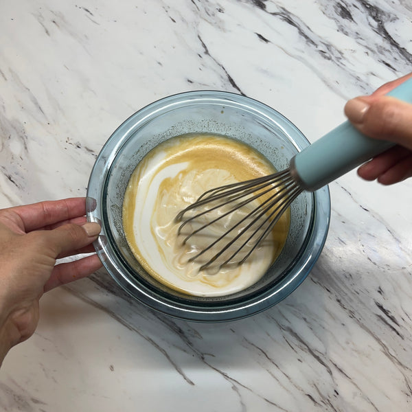 mixing the coconut milk into the wet ingredients