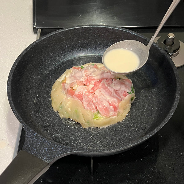 adding another layer of batter on top of the negiyaki