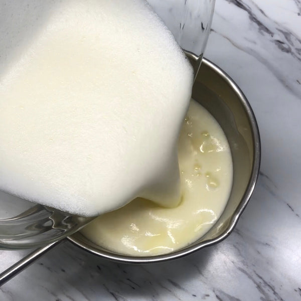 adding cream into the custard mixture