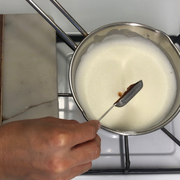 adding vanilla extract to the custard mixture