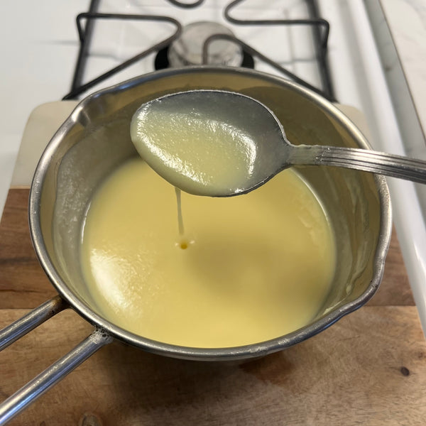 mixing the custard mixture until it thickens