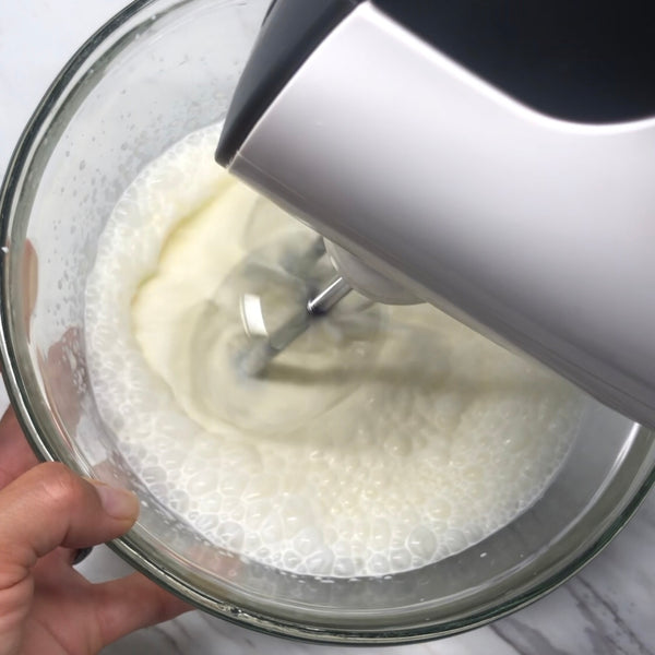 whipping heavy cream with a hand mixer