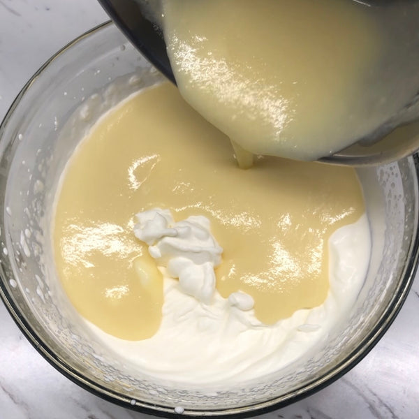 adding the custard mixture into the heavy cream