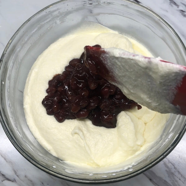 adding the prepared red beans into the ice cream mixture