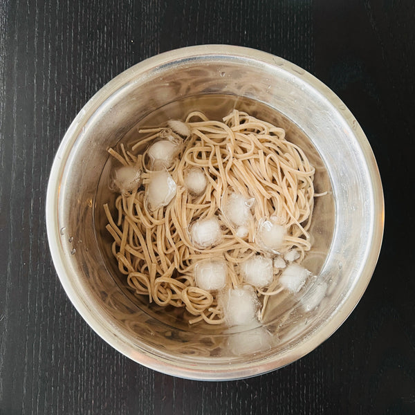 rinsing the soba noodles in ice water