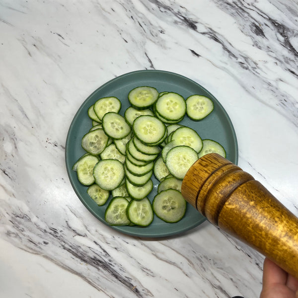 seasoning the cucumbers with salt