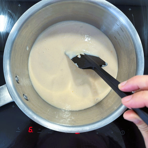 heating the white bean paste over low heat