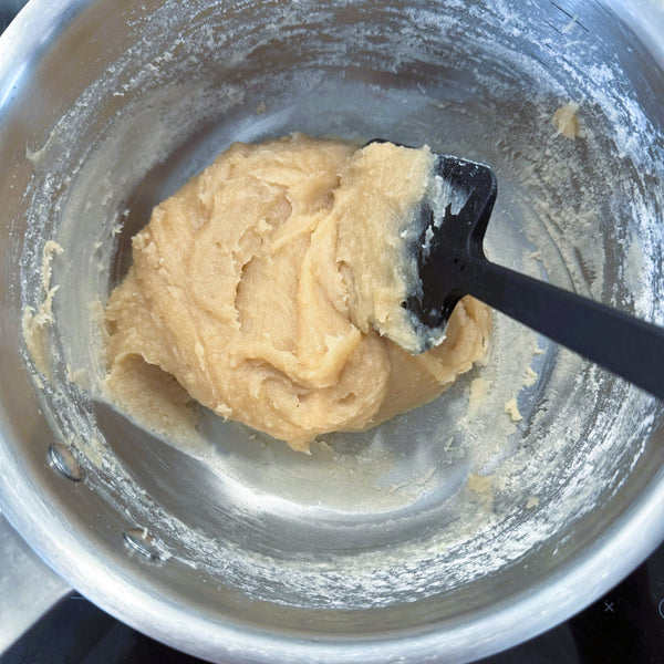 evaporating the liquid from the white bean paste