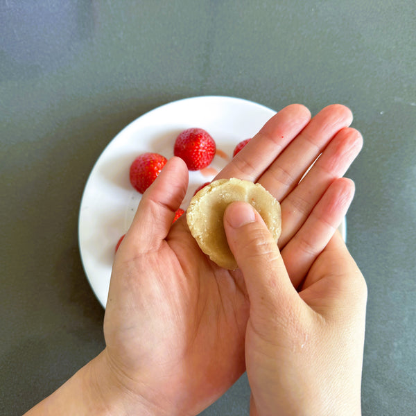 flattening the white bean paste ball