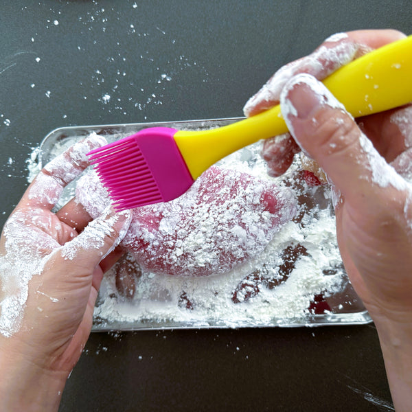 brushing potato starch onto your hands