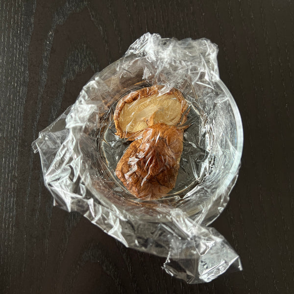 soaking dried shiitake mushrooms in water