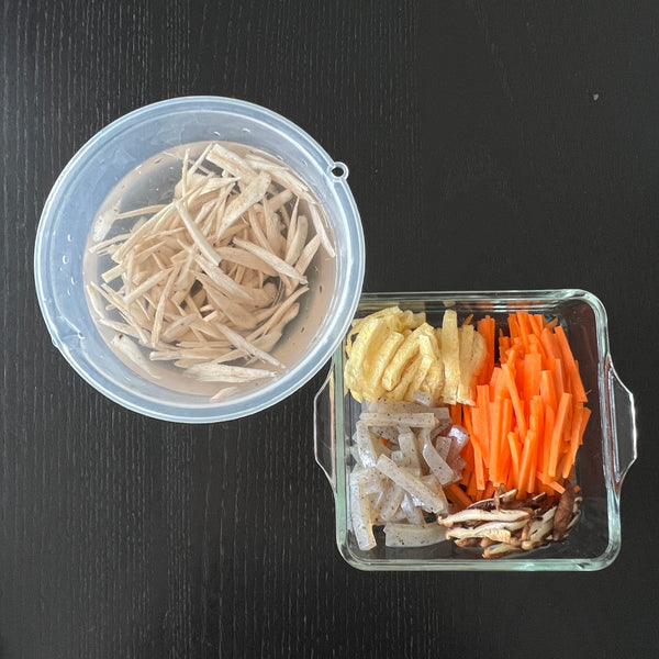 cutting all of the ingredients into julienne strips