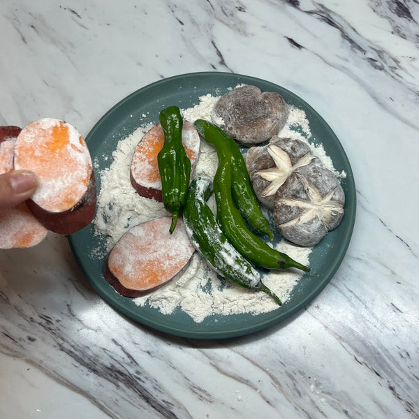 dusting the vegetables in flour