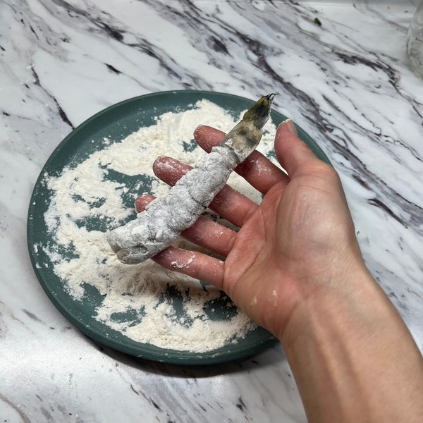 dusting the shrimp in flour