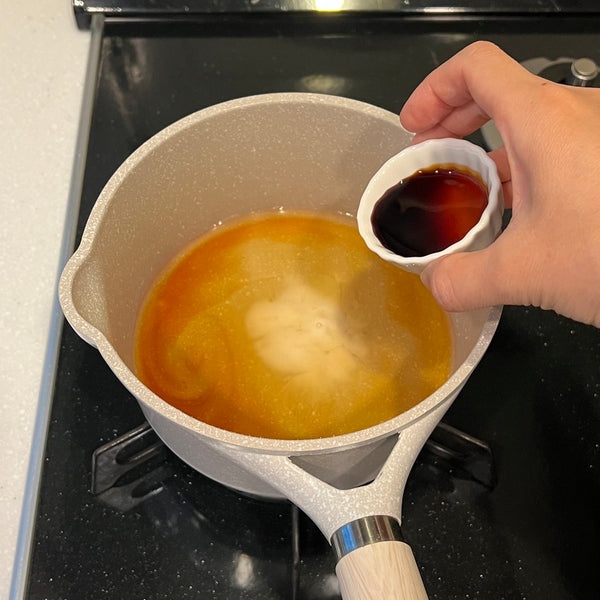 adding the seasonings to a saucepan