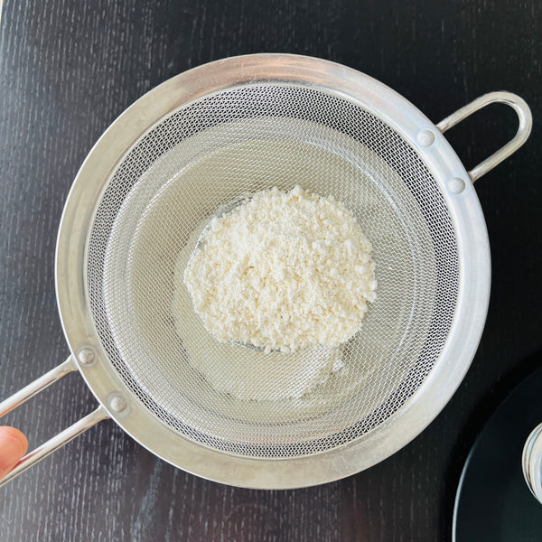 sifting the flour for tempura batter