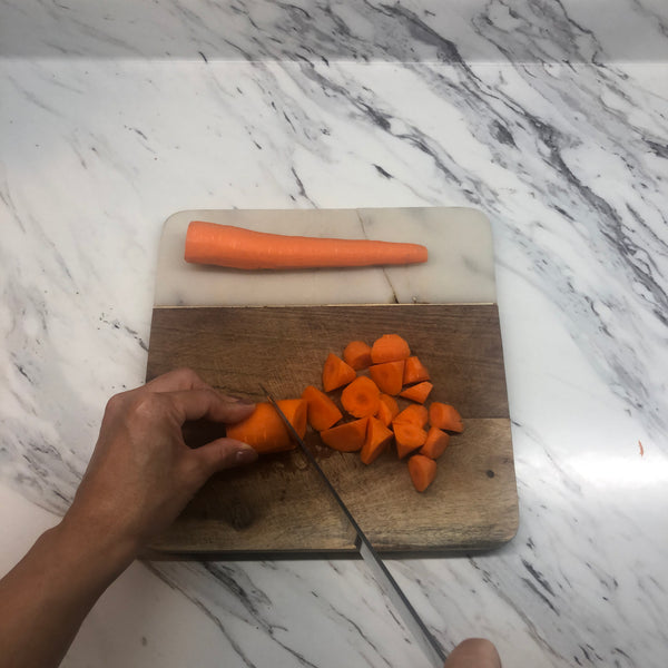 peeling and cutting up the carrots