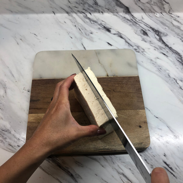 Slicing the tofu in half