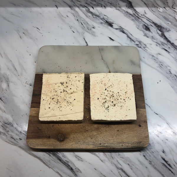 seasoning each tofu cutlet with salt and pepper