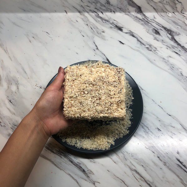 coating the tofu with panko bread crumbs